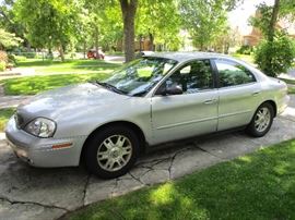 2005 Mercury Sable GS, 105,000+ miles.  Has a kiss or two on it but seems to be mechanically sound.  Available NOW for $950.