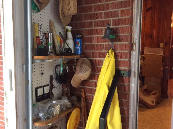 Garage - hats, more cleaning supplies, great bell on wall 