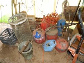 RV Building - crates, gas cans, vintage ice cream freezer, cords, etc