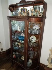Antique 1900's curved glass china cabinet with rope front columns