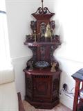 "ETAGEREE" CORNER CABINT- This peice will catch anyones eye immediately, picture doesn't do it justice.
Made in "INDONESIA", "Hand Carved" (Victorian style) "Nice detail"