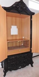 Deep brown lacquer media cabinet in open position. Opening is 32" across. 