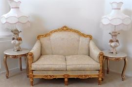 Loveseat SOLD--lamps and tables available. REDUCED--25% OFF. Silik Fine Italian Furniture loveseat framed in carved gilt wood. 51"w, 30 1/2" deep. $1,560. Comparable retail: $4,452. End tables-marble top over gilt wood base, doe feet. 21 1/2" diameter, 22"h. Capodimonte lamps-$250 ea