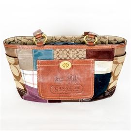 Coach Leather Patchwork Shoulder Bag: A Coach leather patchwork shoulder bag. This purse is composed of two side pockets, a top zipper closure, and an interior zipper pocket. Serial no. G0773-11358.