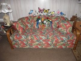 Rattan sofa bed, lamps, metal butterflies and parrots