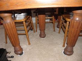 Underside of five leg Oak antique table with two leaves