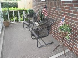 Metal bouncy chairs, tables, outdoor rugs, plants