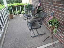 Metal chairs and tables, rugs, plants
