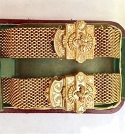 This is a pair of Victorian gold-mesh slide bracelets in their original box.