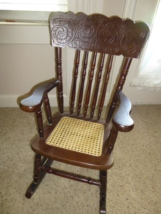 VINTAGE CHILD'S ROCKER WITH CANE SEAT AND CARVED BACK