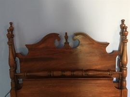 The wood grain on this bed looks like a melody - or clouds.