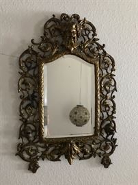 old ornate mirror with candle holders