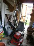 lawn mower and lots of garden tools