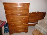 chest of drawers and bed