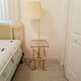 Polished brass magazine rack table lamp.
