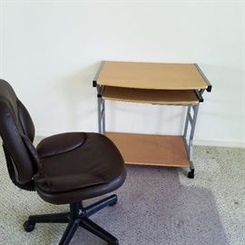 Small rolling computer desk with leather desk chair in excellent condition.