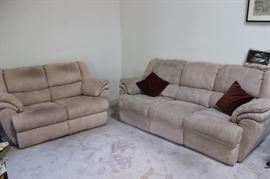 Matching dual reclining sofa and loveseat.