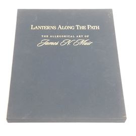 James N. Muir Limited Edition Art Book "Lanterns Along the Path": A limited edition art book by James N. Muir, titled Lanterns Along the Path: The Allegorical Art of James N. Muir. This hardcover book catalogs the bronze sculptural work of the titular artist with full-color reproduction photos and accompanying text. Found on the end page is a personal inscription from the artist, as well as a handwritten signature and edition number, 63 of 200. The book is contained in a slipcase containing gold tone inlay lettering to the surface.