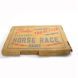 1940s-Era Tudor "Tru-Action" Electric Horse Race Game: A “Tru-Action” Electric Horse Race Game, produced by Tudor Metal Products circa the 1940s. This game features a vibrating metal board and several racehorse-shaped game pieces on specially designed bases which are designed to move forward as the board vibrates; Tudor used the same vibrating propulsion system to develop the first electric football game in 1949. The game box has a simple red and blue design with lightning bolts and text reading “Tudor Tru-Action Electric Horse Race Game”. The side of the box is marked “Tudor Metal Products Corp.”, “Brooklyn, N.Y. U.S.A.”, “Pat. No. 2167985 Other Patents Pend.” and “For A.C. Only”.