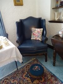 One of three leather wing chairs.