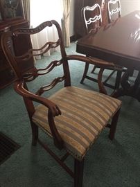 One of six Chippendale style ladder back chairs.