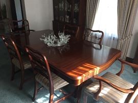 Mahogany Chippendale style dining room table with two leaves & pads + six Chippendale ladder back style chairs.