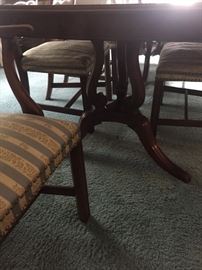 Base of mahogany dining room table.