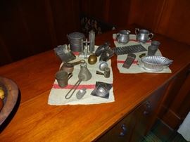 Collection of small antique tin items.