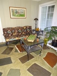 Wrought iron settee and tables.