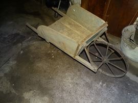 Antique wooden wheelbarrow.