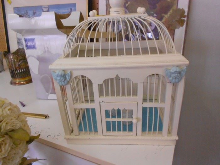 Bird cage decorated as candle holder