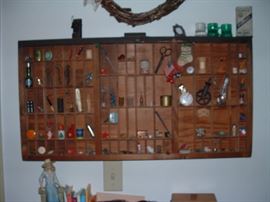 Printer cabinet drawer filled with knick knacks