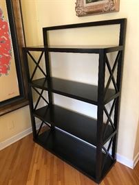 There are 2 of these custom shelves made of solid ebony wood
