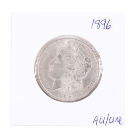 1896 Morgan Silver Dollar: An 1896 Silver Morgan Dollar. Designer: George T. Morgan. Mintage: 9,976,000. Metal Content: 90% silver, 10% Copper. Diameter: 38.1 mm. Weight: 26.7 grams. Uncirculated.