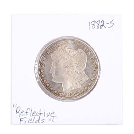 1882-S Morgan Silver Dollar: An 1882 S Silver Morgan Dollar. Designer: George T. Morgan. Mintage: 9,250,000. Metal content: 90% silver, 10% copper. Diameter: 38.1 mm. Weight: 26.7 grams. Circulated.