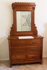 Victorian Drop Center Marble Top Dresser. Carved with Swing Mirror & 3 Drawers.  16"Deep x 32" Dresser top to floor; 70" floor to top of mirror   $375.00