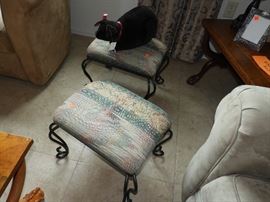 matching footstools with iron legs.