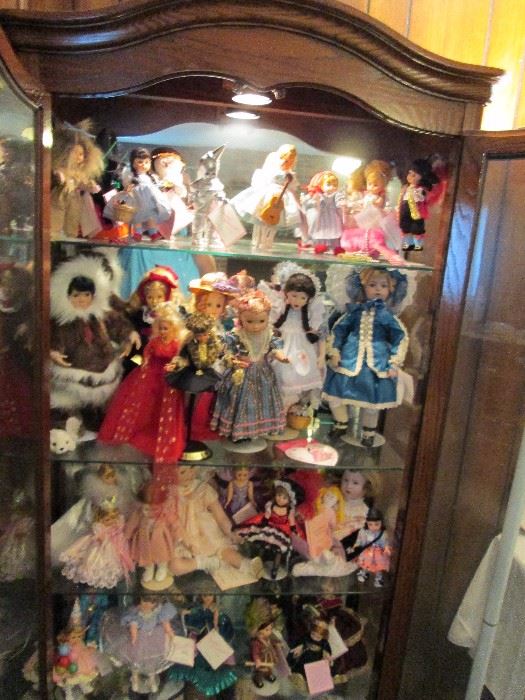 Madame Alexander dolls.  Wizard of Oz set on top shelf