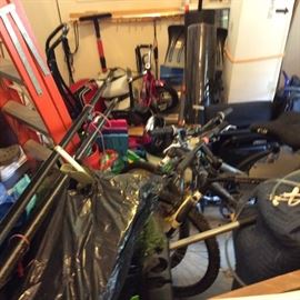 AND LOOK AT ALL THE STUFF WE HAVE YET TO GET TO. THERE ARE 4 BIKES UNDER THERE, LADDERS AND YARD TOOLS