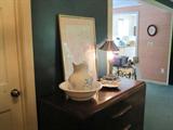 Dresser, antique pitcher and bowl, lamps and décor.