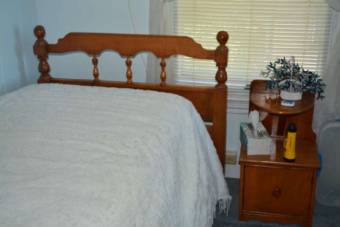 Twin bed with new mattress, bedspread, nightstand