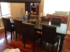 Pottery Barn Rustic Table 6' to 9' w 2 Leaves and 8 leather chairs.  4 Piece Modular Wine Rack/Cabinet also by Pottery Barn