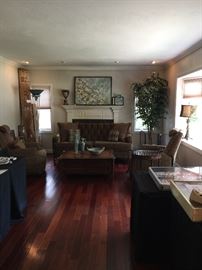 Exceptional chocolate velvet tufted back couch purchase from the Michigan Design Center with a solid wood sliding top barley twist leg coffee table