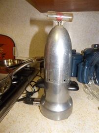 This is a rocket form of a vintage Sunbeam Baby Bottle warmer