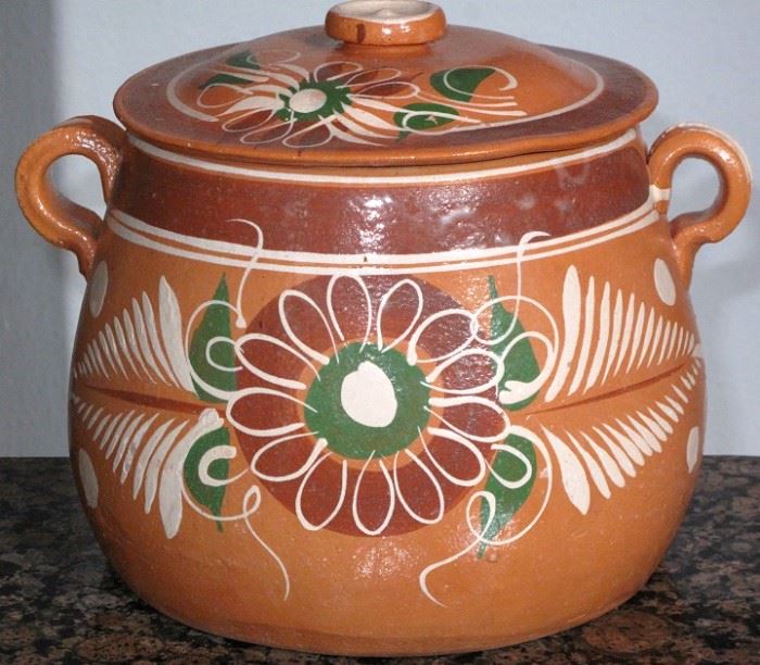 Lola de Barro (crock pot).  Traditional Made in Mexico Terra-cotta Hand Painted Bean Pot.This is a lovely bean pot. Made by folk artisans in Mexico the workmanship is wonderful as well as the hand painted decorations.  Measures 7" tall with lid 
7 1/2" in diameter across the bottom