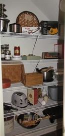 Pantry showing miscellaneous appliances, cookware, baskets, etc.