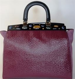 Lot 91. Tory Burch Bordeaux Plum Attersee Satchel