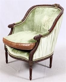 Lot#10, LOUIS XVI-STYLE BERGERE CHAIR, H 35", W 28", D 32"Having green velvet, silk, and leather upholstery. Raised on tapered fluted legs.