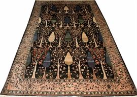 Lot#186, INDIAN HERATI HAND WOVEN WOOL CARPET W 8' L 12'8''Having a black ground, three borders including a wide pink primary border with flowers and vines. Tree motif lying in one direction with shades of purple, blue, brown and beige.