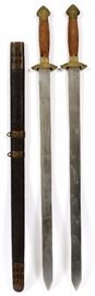 Lot#328, CHINESE FIGHTING SHUANGJIAN (DOUBLE SWORDS) AND SCABBARD, 19TH C, 3 PCS., L 26" BLADE. Two swords in one ray skin scabbard. Both having double edged blades, flat on one side and ending in sharp points. Each blade also has seven brass inlaid dots representing Ursa Major (Big Dipper) an important constellation in Taoism. Bronze guards with scroll designs. Pommel is also of bronze with dragon motif. Carved wood grips with pierced brass ferrules with dragons. They are exact mirror images of each other and appear as one sword in the scabbard.  Scabbard has pierced design bronze hangers. Pierced design brass chape and locket. From the collection of Mrs. G. G. Scranton, international traveler from the late 1800's to the mid twentieth century. Friend and patron of Mrs. Dagny Carter, a notable scholar, influenced this collection.